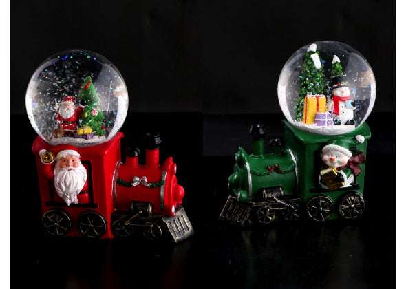 2 Palla di neve di Natale con base a forma di locomotiva e luci LED. Sfondo nero, locomotive rossa e una verde.