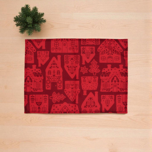 tovaglietta di natale rossa in tessuto su un piano di legno