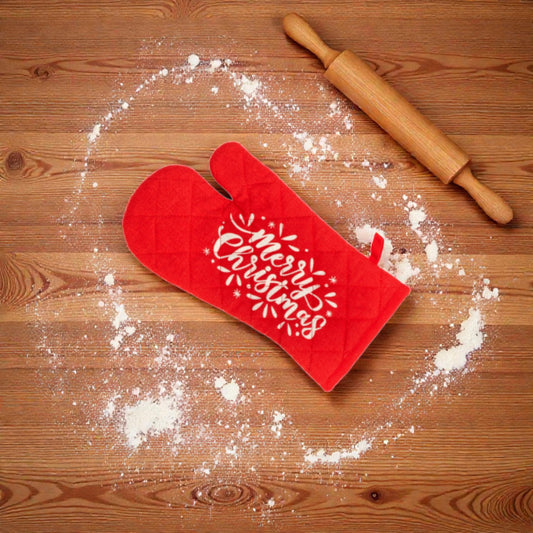 Guanto da cucina rosso a tema natalizio un piano in legno con farina e mattarello