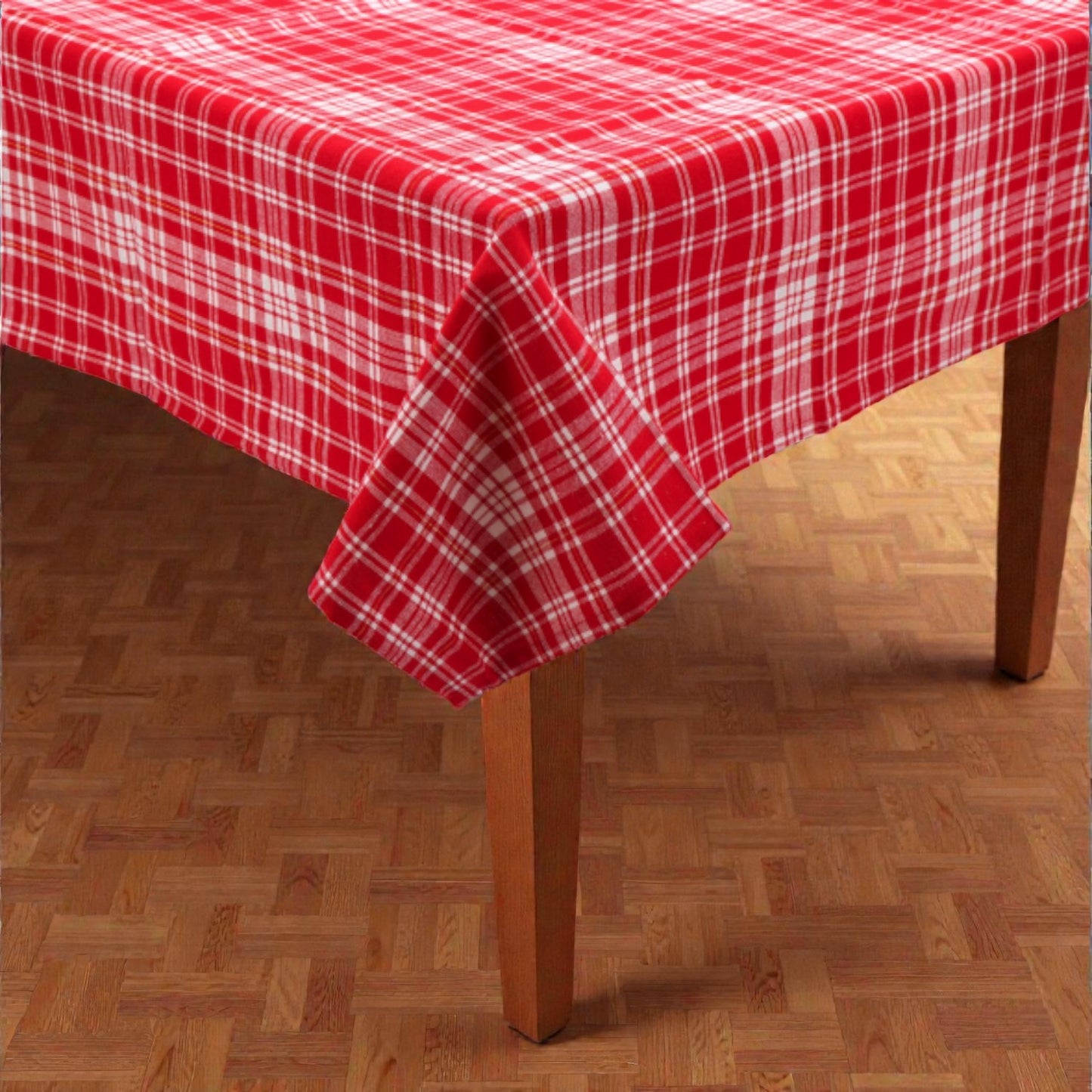 Tovaglia di Natale rossa plaid Melin in tessuto con motivi natalizi, su un tavolo in legno
